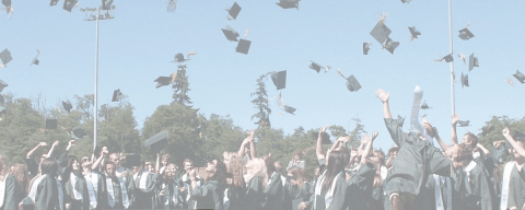 generic graduation image with graduates tossing hats into the air