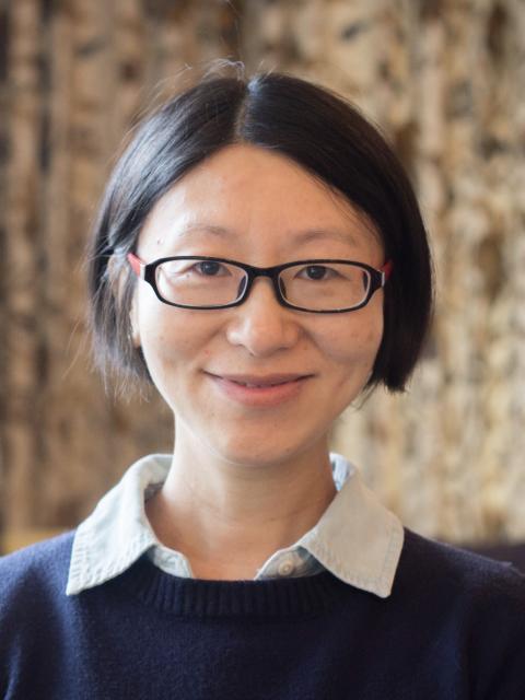 Liu Yang is a woman with glasses and short black hair
